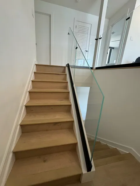 Staircase finished to match the main floor, looking up to the second level