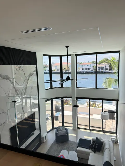 Glass rail loft overlooking the great room floor