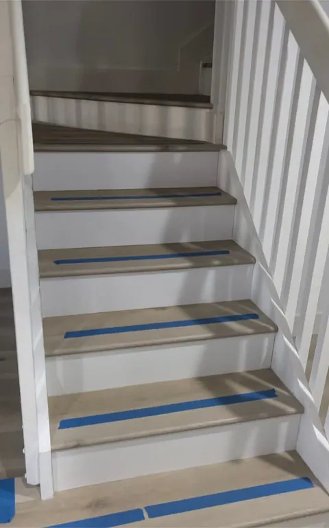 Luxury vinyl plank installed on a staircase