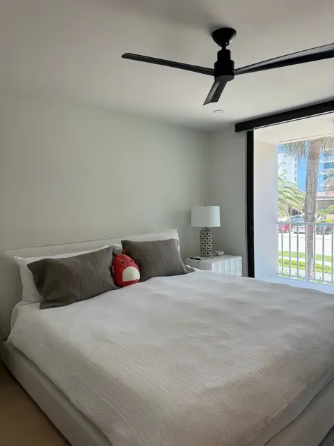 Second bedroom with light plank flooring