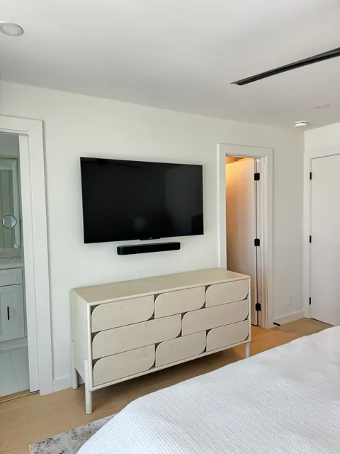 Third bedroom with light plank flooring
