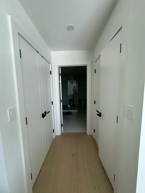 Upstairs hallway with wide plank flooring